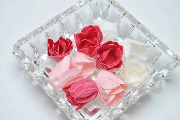 Artificial roses in glass bowl on white background — Stock Photo, Image