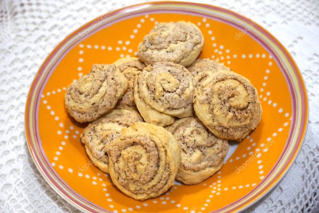 Fresh baked homemade swirled cookies on the small plate from the top