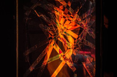 Fire behind a broken window by military action