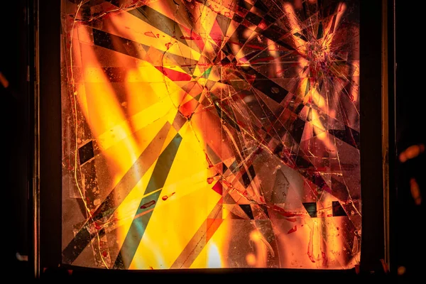 Fire behind a broken window by military action