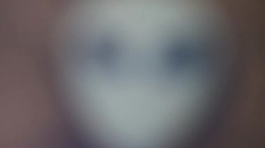 Alien mask on the background of nature