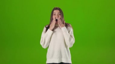 Excited woman open mouth from unexpected surprise in studio