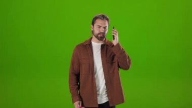 Aggressive guy shouting on megaphone while talking on mobile