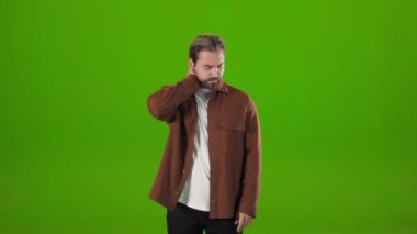 Caucasian guy suffering from pain in neck