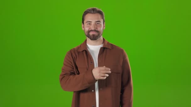 Positive man doing scrolling gesture with hand in studio — Stock Video