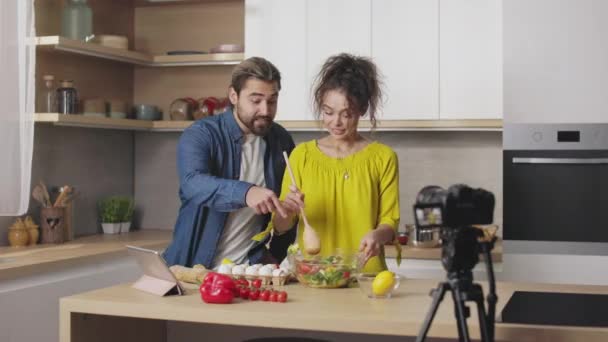 Emotional Caucasian Couple Gesturing Talking While Recording Video Camera Cooking — Stock Video