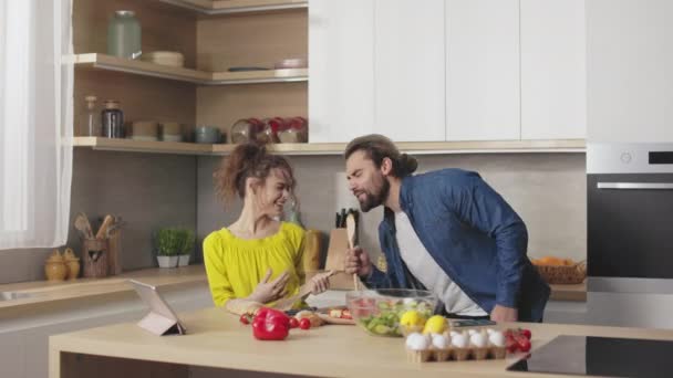 Carefree Caucasian Couple Dancing Singing Together Kitchen Wooden Spoons Hands — Stock Video