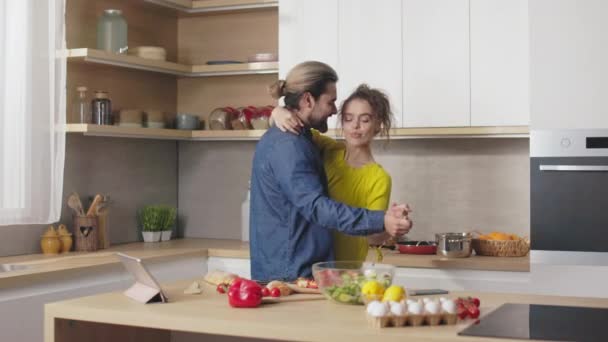 Beautiful Affectionate Caucasian Couple Dancing Embrace Bright Kitchen While Cooking — Stock Video