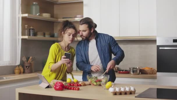 Caucasian Man Woman Watching Recipe Online Modern Smartphone While Cooking — Stock Video