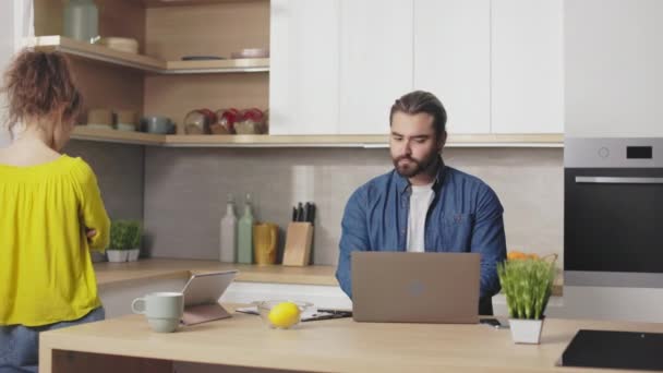 Handsome Bearded Man Working Laptop Hugging His Wife Feeling Sad — Video Stock