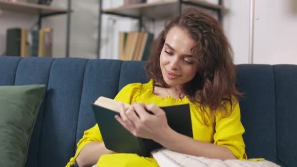 Young Caucasian Woman Taking Break Home Routine Reading Book While — 图库视频影像