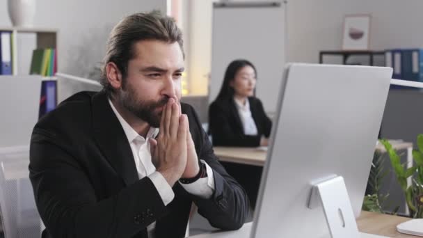 Worried Man Sitting Office Desk Clasped Palms Looking Computer Screen — Stockvideo
