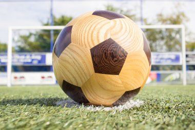 Wooden football on penalty spot clipart