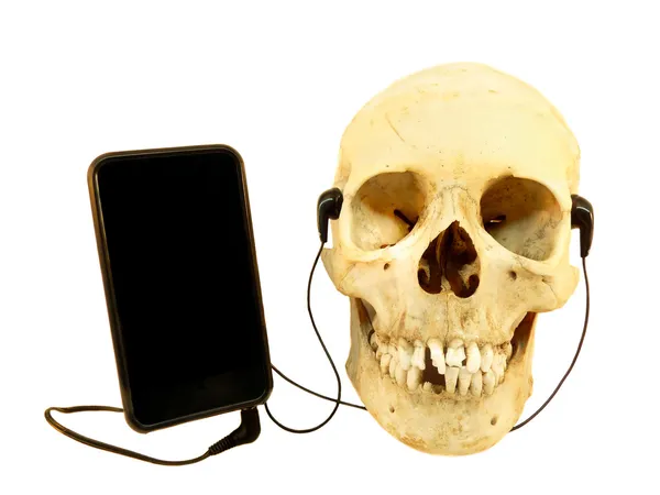 Crânio humano ouvir música — Fotografia de Stock