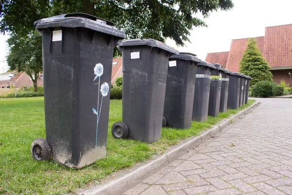 Grey garbage containers in a row — Stock Photo, Image