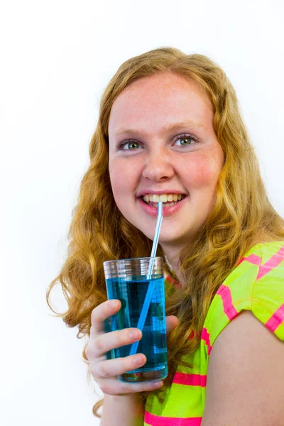 Girl drinks blue soft drink — Stock Photo, Image