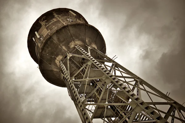 Water tower under dark clouds — Stock Photo, Image