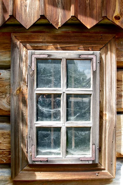 Wooden window with cobwebs behind glass. Traditional cottage, Poland — Stock Photo, Image