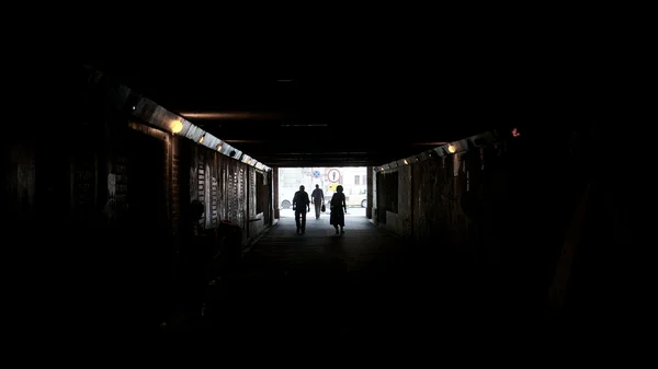 Walking Towards Light at End of Tunnel Royalty Free Stock Images