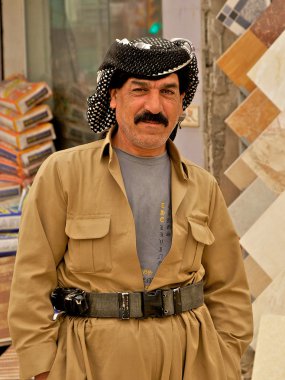 Kurd wearing overall and belt in Arbil, Iraqi Kurdistan, Iraq. clipart
