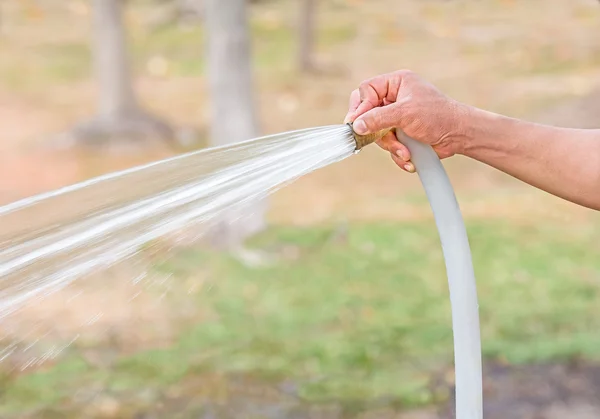 Rubber tube watering — Stock Photo, Image