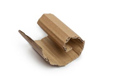 Kraft cardboard piece ripped edge. Isolated on white background