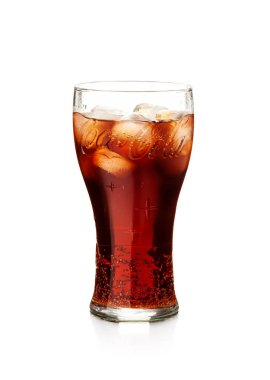 Chisinau, Moldova - July 31, 2022: Cola in highball glass and ice cubes isolated on white background including clipping path.