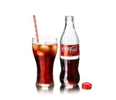 Chisinau, Moldova - July 31, 2022: Classic bottle and glass Of Coca-Cola isolated on white background. With clipping path