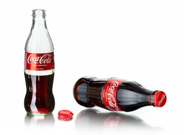 Chisinau, Moldova - July 31, 2022: Classic bottle Of Coca-Cola isolated on white background