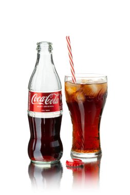 Chisinau, Moldova - July 31, 2022: Classic bottle and glass Of Coca-Cola isolated on white background. With clipping path