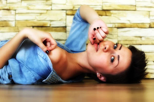 Woman stretching on the floor Stock Image