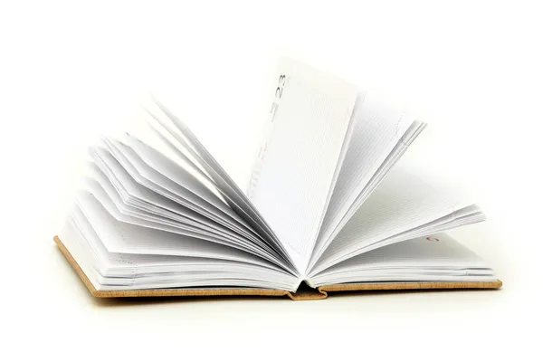 Notizbuch geöffnet auf weißem Hintergrund lizenzfreie Stockfotos