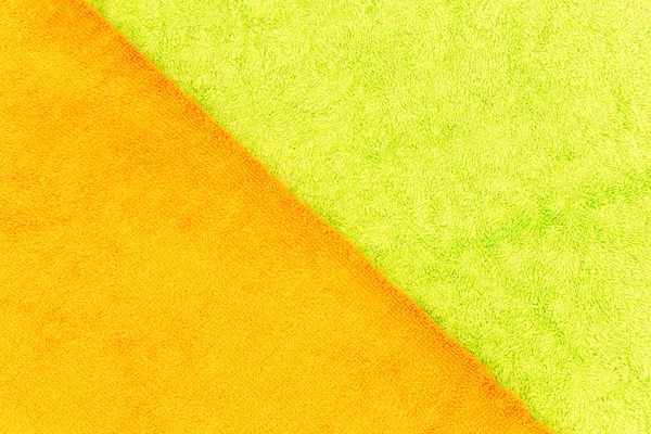 Зеленый и оранжевый фон полотенца — стоковое фото