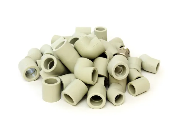 A lot of combined fittings for plastic pipes — Stock Photo, Image