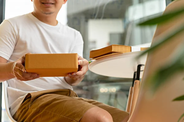 Man wearing white shirt will send the parcel. box delivery concept. Packaging boxes for express delivery. happy man  with pick up and delivery with fast delivery service. transportation concept.