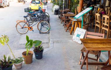 Tulum cafes in restaurants serving national Mexican cuisine and seafood in historic city center frequented by locals and international tourists clipart