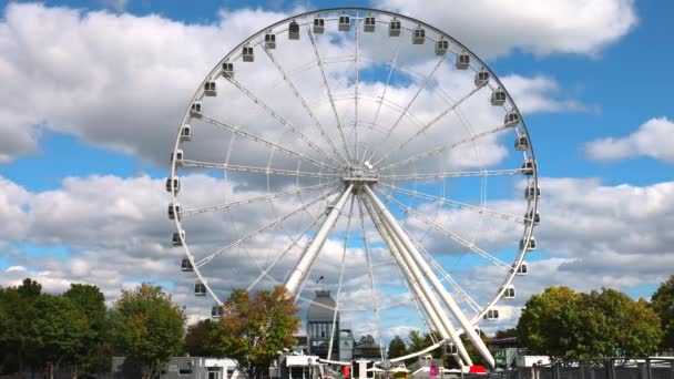 Panoramic observation Ferris wheel, La Grande roue de Montreal, located on Bonsecours Basin Island in the Old Port of Montreal — Stock Video