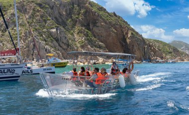 Transparent boat trour to Arch of Cabo San Lucas, El Arco, close to Playa Amantes, Lovers Beach known as Playa Del Amor and Playa del Divorcio, Divorce Beach clipart
