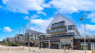 Innisfil, Ontario, Canada, 10 July, 2022: Scenic Innisfil town in Ontario and lake promenade with marina views, shops, cafes and restaurants