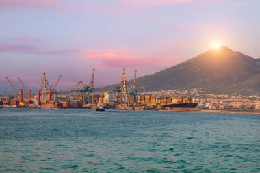 Container cargo ships in Italy Naples port and terminal industrial dock for freight shipment.