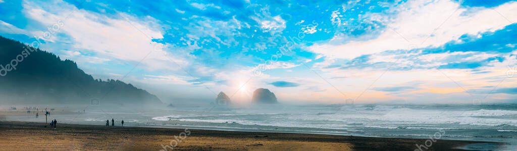 USA, Portland, Oregon, scenic Cannon Beach Haystack Rock formations on Pacific ocean.