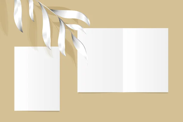 isolated realistic half-fold standart leaflet with silver leaves on the sand color background editable mockup for layout presentation, empty page, set