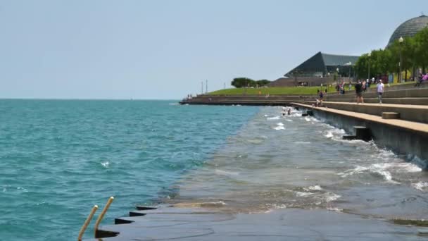 Chicago, Lake Michigan Waves Under Boardwalk With Overview on Adler Planetarium — Stock video