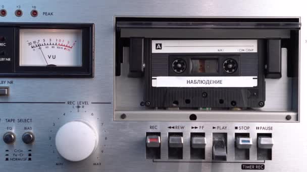 Audio Cassette Tape With Russian Surveillance Recording in Deck Player, Close Up — Stock Video