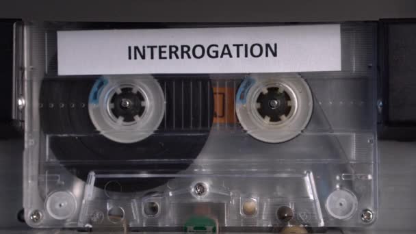 Interrogation Recording on Audio Cassette Tape in Vintage Deck Player, Close Up — Stok video