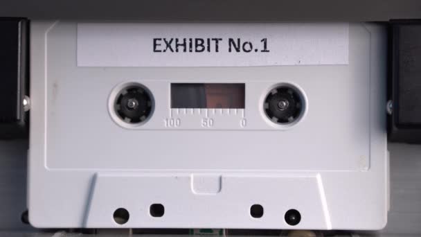 Exhibit No. 1 Cassette Tape Playing in Vintage Audio Deck Player, Close Up — Stock Video