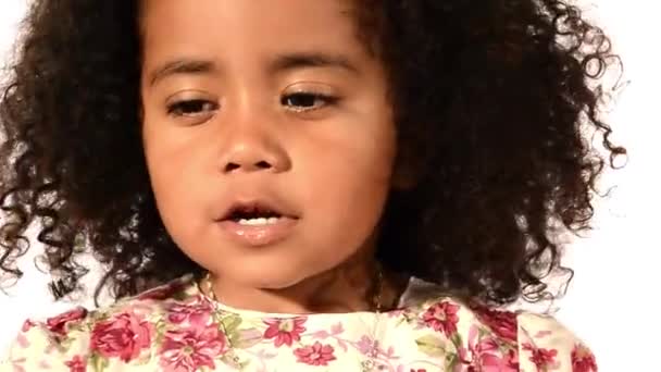 Funny mixed race black and latino brazilian little girl isolated blowing soap bubbles — Αρχείο Βίντεο