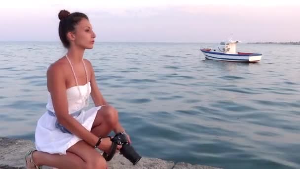Nice girl taking a photograph with her camera — Stock Video