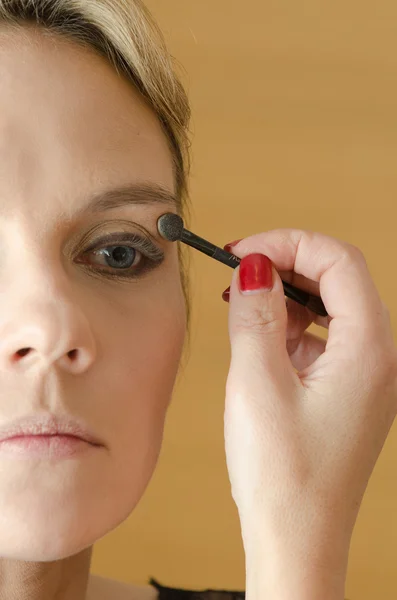 Young woman in make - up process — Stock Photo, Image