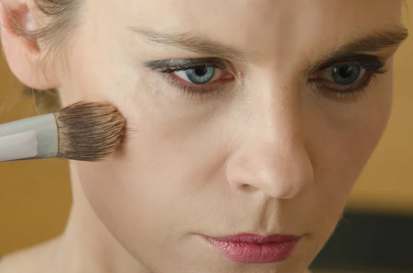 Young woman in make - up process — Stock Photo, Image